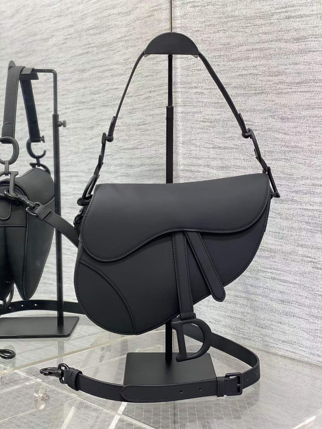Saddle Bag in black ultra-matte calfskin leather with adjustable shoulder strap