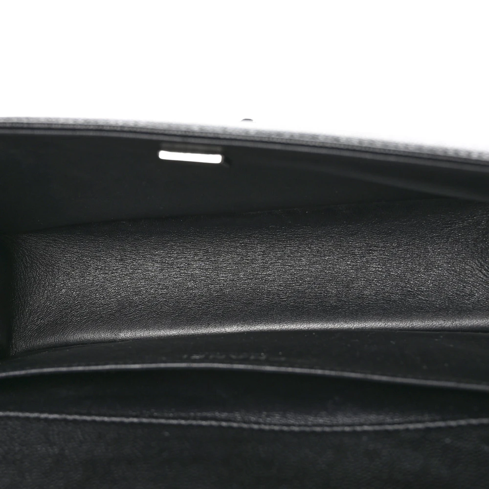 Interior view of the Medium Boy Flap with leather lining, zip pocket, and organized storage compartments