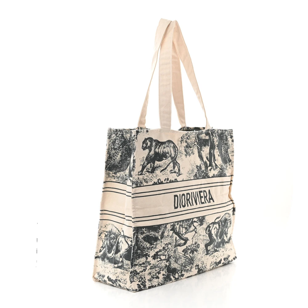 side view of the D!0r blue embroidered Medium Dioriviera Tote