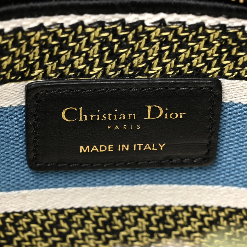 Close-up of the signature letter charms and gold-tone hardware on the latte D-Constellation Medium Lady D-Lite bag