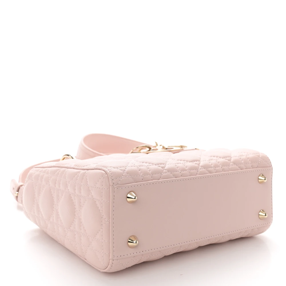 Bottom view of the D!0r Light Pink Cannage lambskin small bag showing the structured leather base