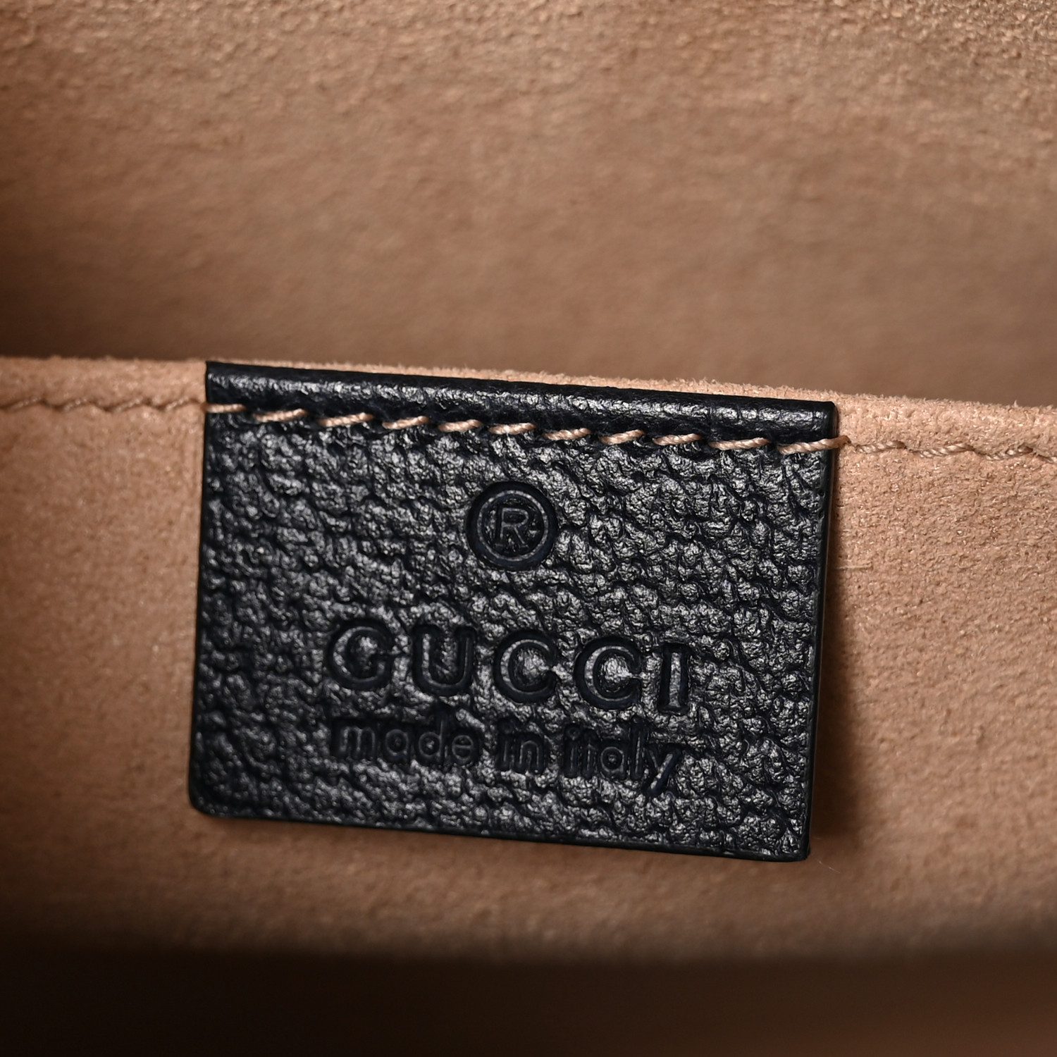 Close-up of the GG Supreme monogram canvas, Web stripe, logo detail, and gold-tone hardware