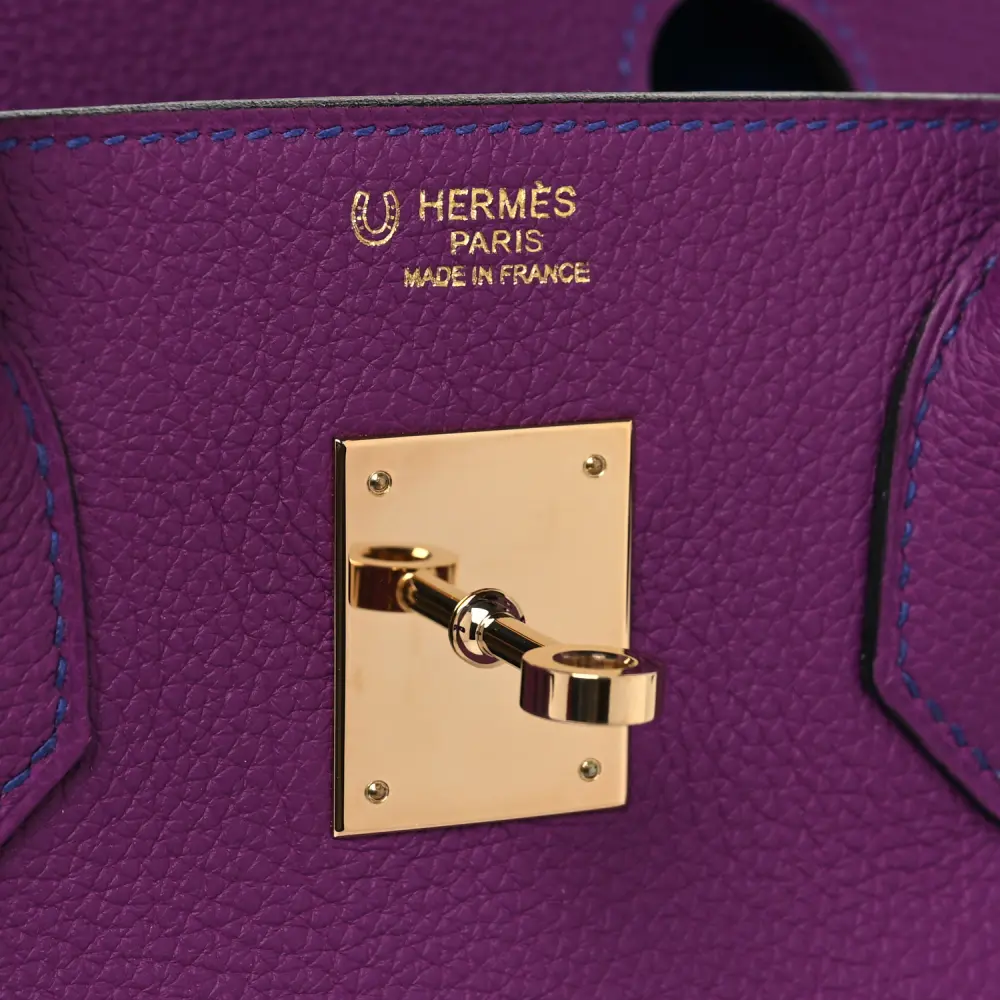 Close-up of the Herme$ Horseshoe Birkin 30 lock, gold hardware, and signature sangles straps
