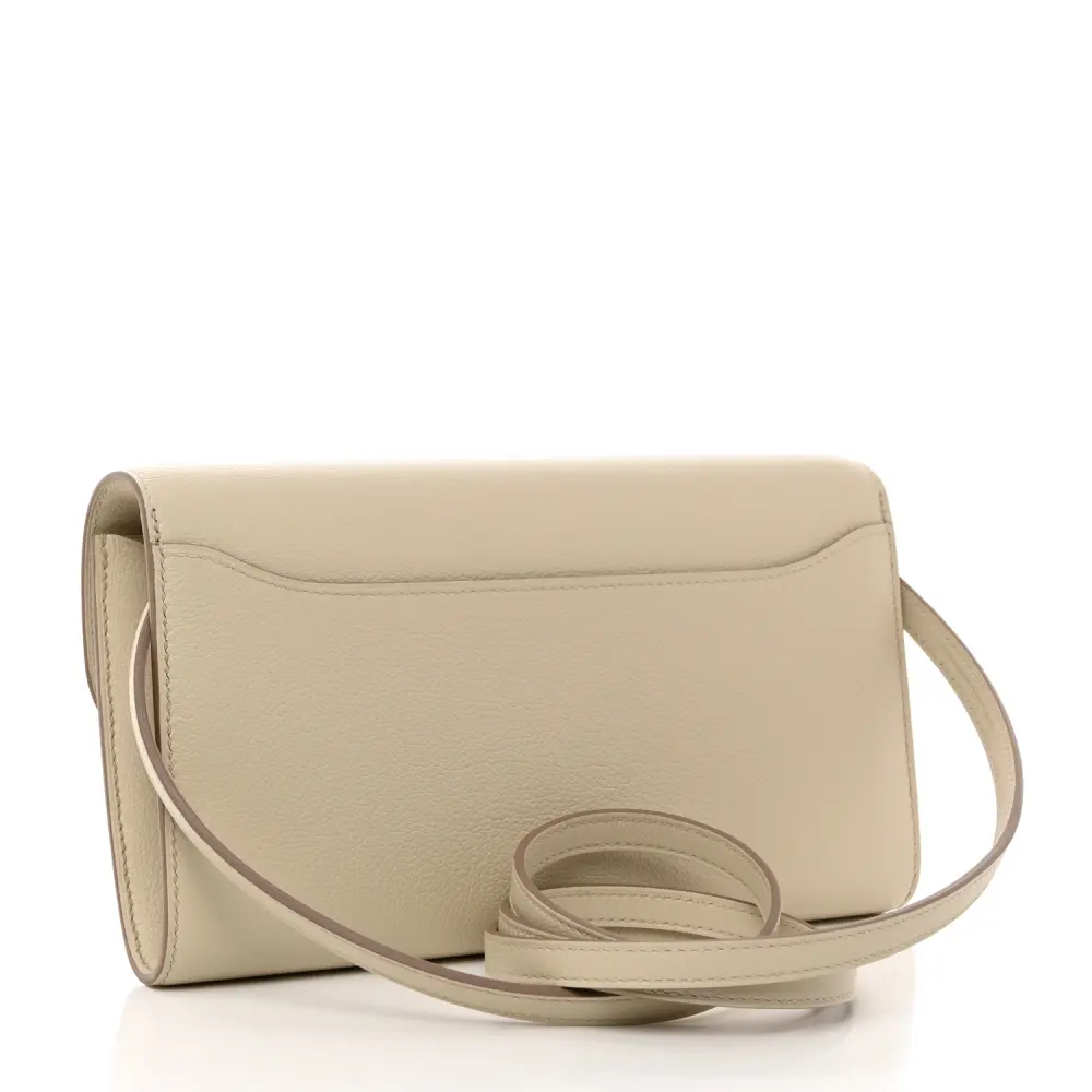 Back view of the Herme$ Evercolor Leather Constance Wallet To Go in Béton