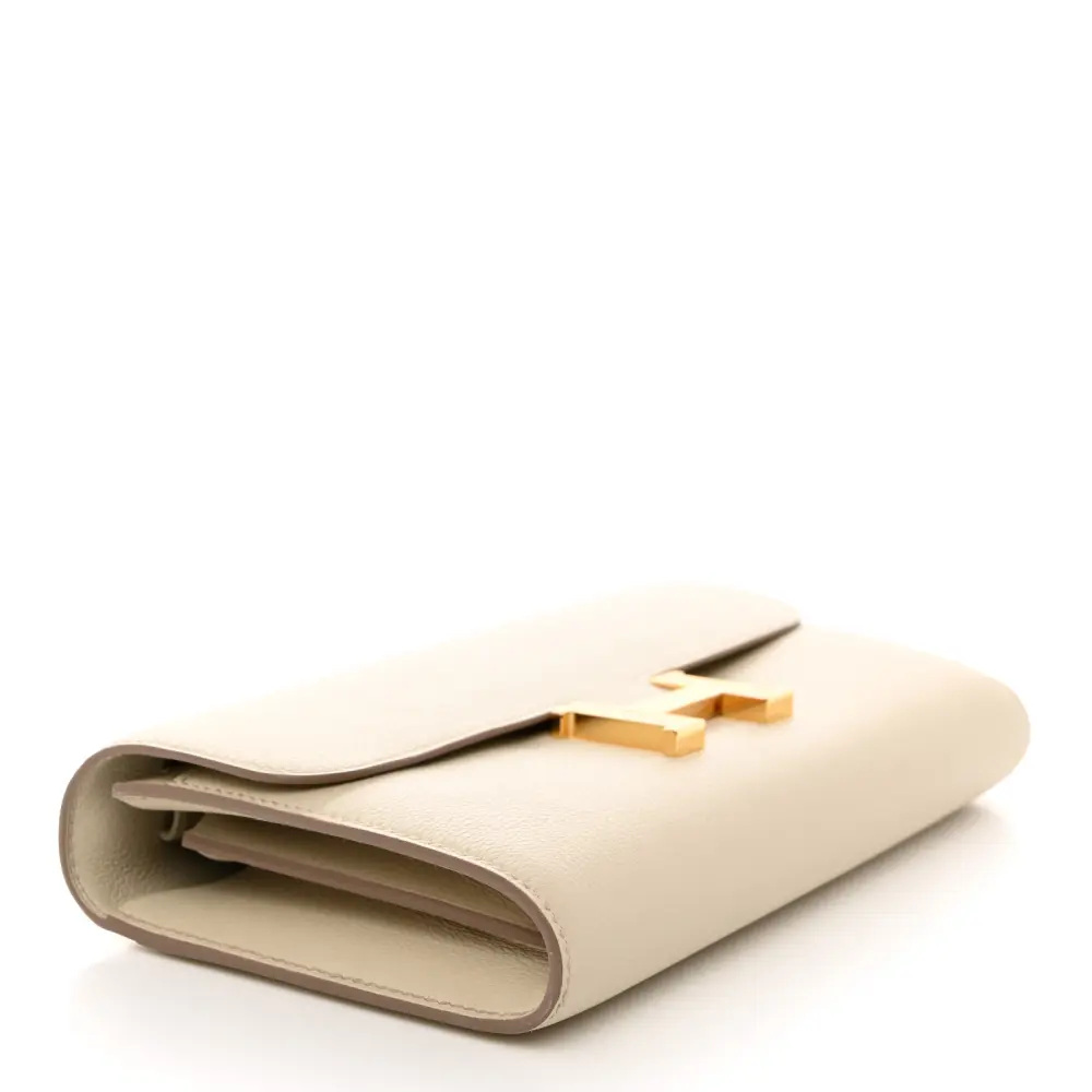 Bottom view of the Herme$ Evercolor Leather Constance Wallet To Go showing the leather base