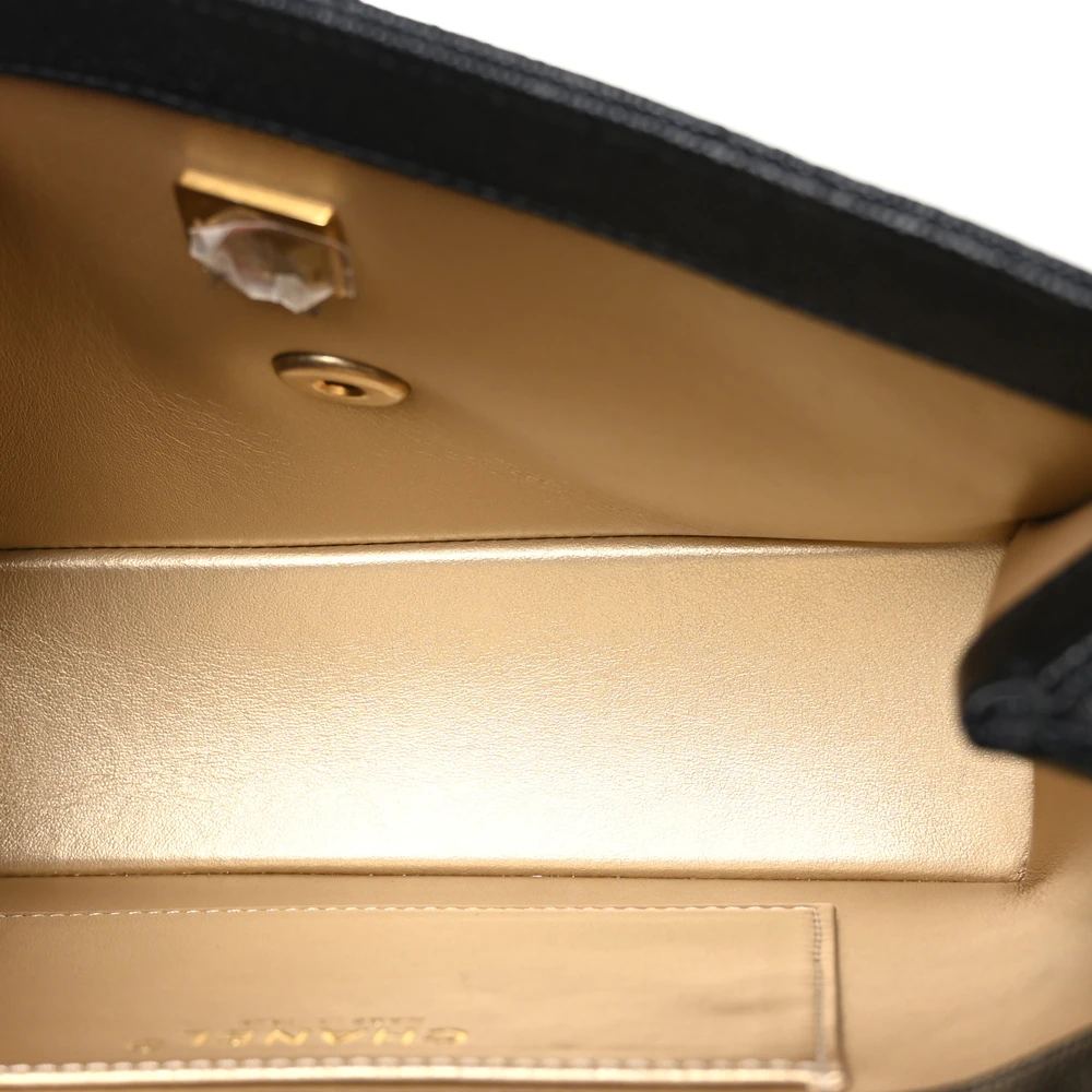 Interior view of the black caviar leather Ch@nel Medium Carry Me Flap with organised storage compartments