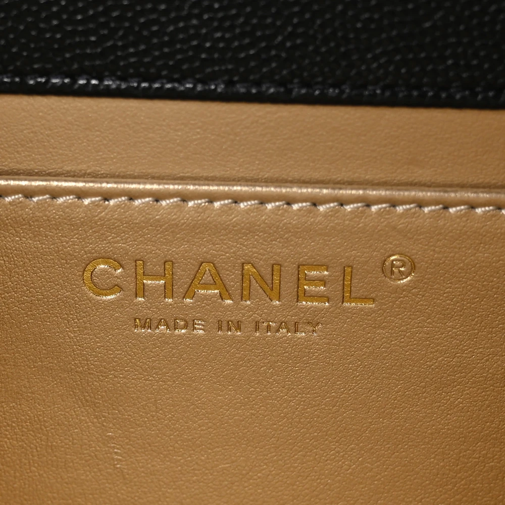 Close-up of the CC turn lock, top handle, and gold chain strap with shoulder pad on the Medium Carry Me Flap