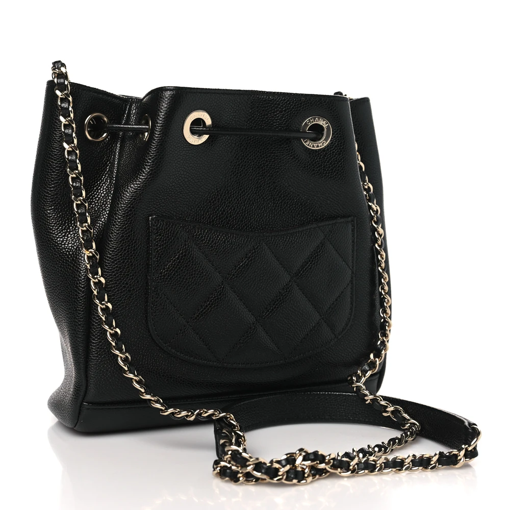 Back view of the black quilted caviar leather Mini CC Pocket Bucket Bag with quilted front pocket