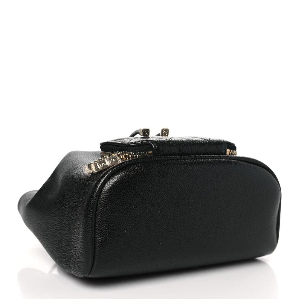 Bottom view of the black quilted caviar leather Mini CC Pocket Bucket Bag with quilted front pocket