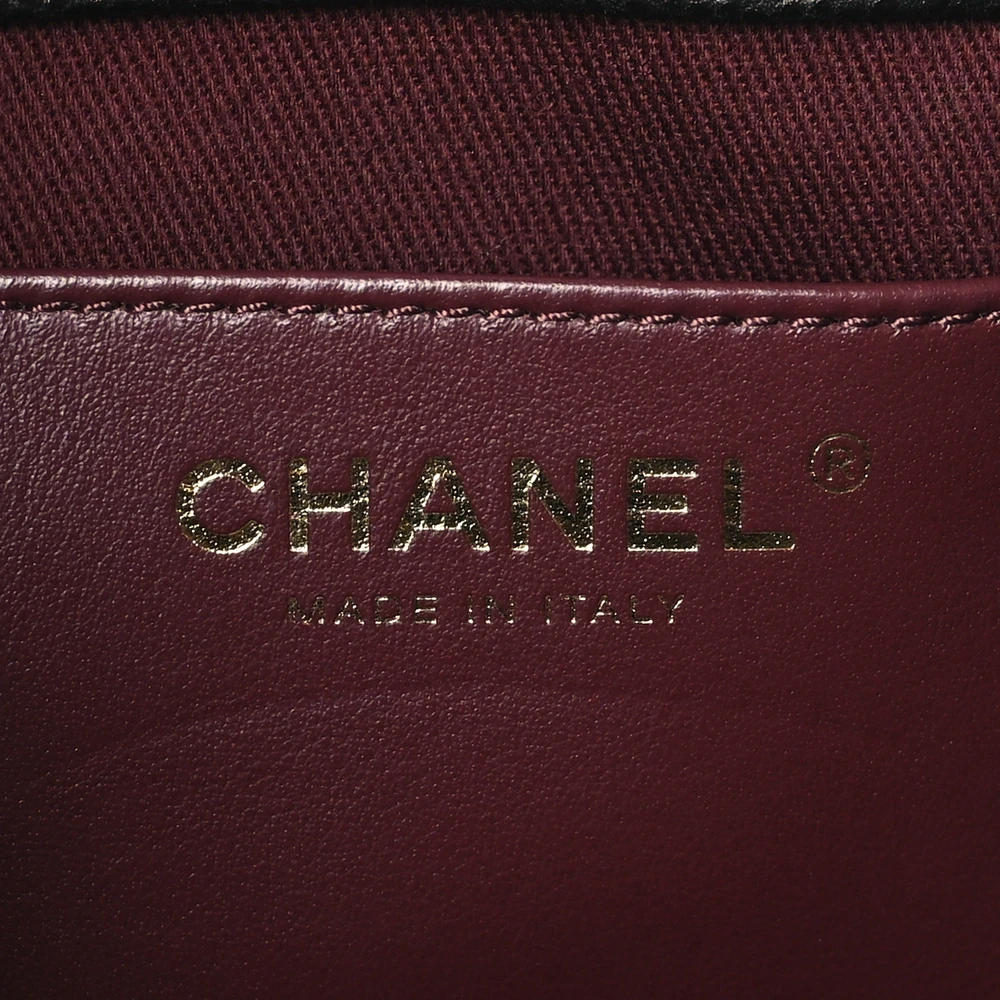 Close-up of the CC detail, light gold hardware, and chain-link strap on the Ch@nel Mini CC Pocket Bucket Bag