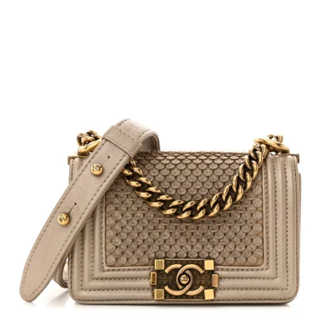 Front view of the metallic gold quilted lambskin Mini Scaled Boy Flap with aged gold chain strap