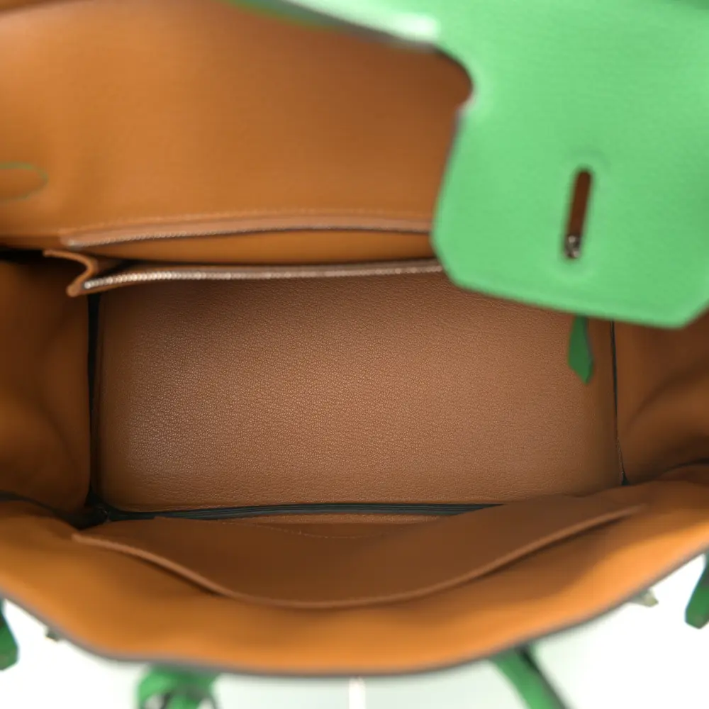 Interior view of the Herme$ Verso Birkin 25 with leather lining, zip pocket, and slip pocket
