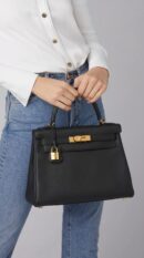 Model wearing the Herme$ Black Togo Leather HAC à Dos GM Backpack with Palladium hardware