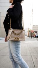 Model carrying the metallic gold quilted lambskin Mini Scaled Boy Flap with aged gold chain strap
