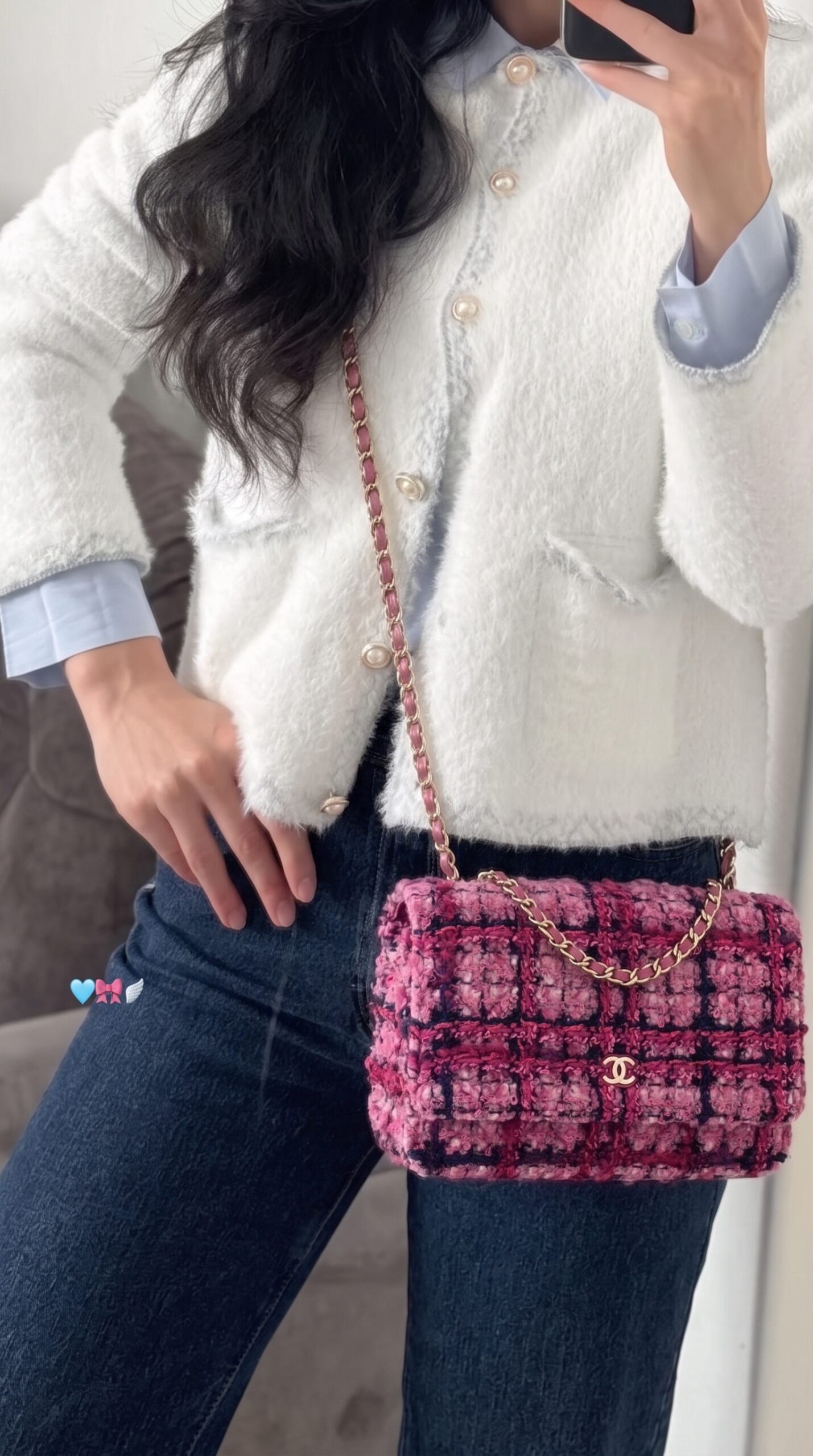 Model carrying the fuchsia and purple tweed Wallet On Chain with gold chain strap