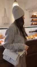 Model carrying the grey lambskin Jumbo Double Flap with gold chain straps