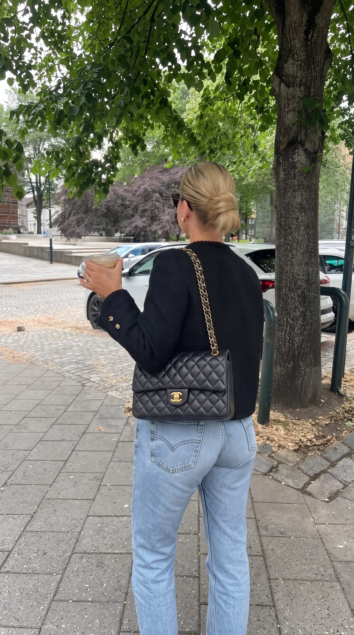 Model carrying the grey gradient lambskin Medium Double Flap with light gold chain shoulder strap