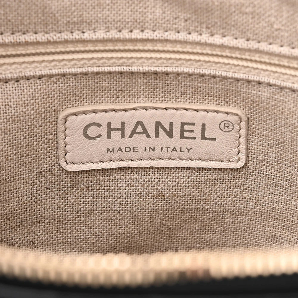 Close-up of the CC zipper pull, gradient metal chain strap, and mixed-tone hardware on the Medium Gabrielle Hobo