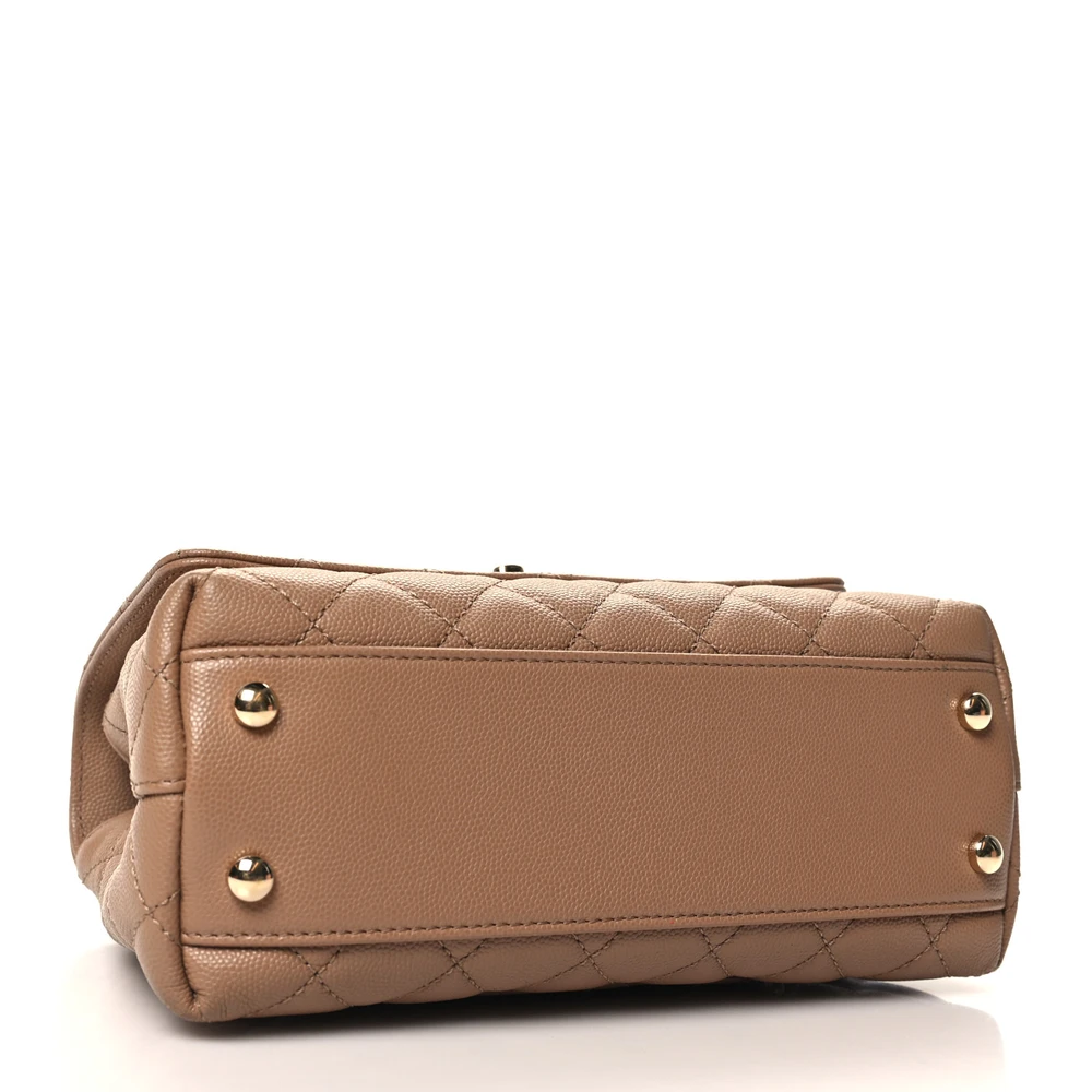Bottom view of the brown caviar leather Mini Coco Handle Flap with gold chain strap