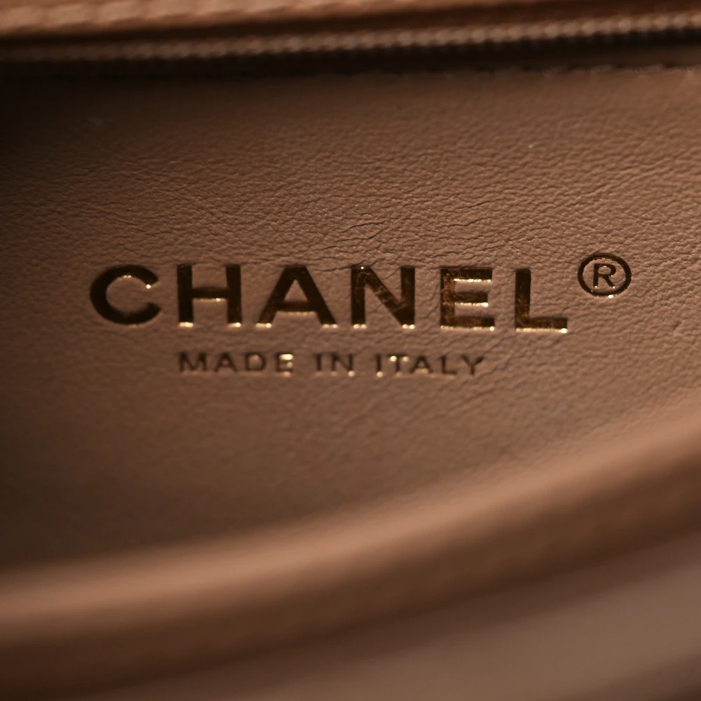 Close-up of the CC turn lock, gold chain strap, and gold-tone hardware on the Mini Coco Handle Flap