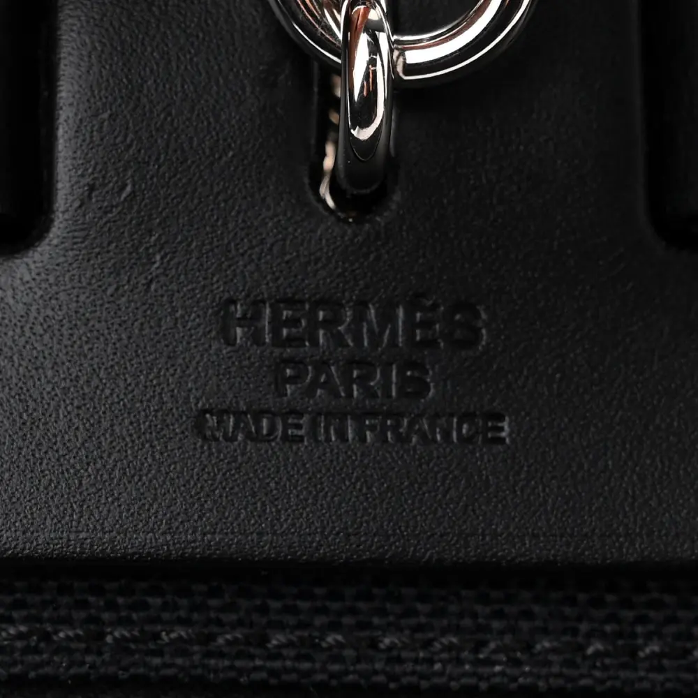 Close-up of the Clou de Selle closure and Palladium hardware on the Herme$ Herbag Zip PM 31