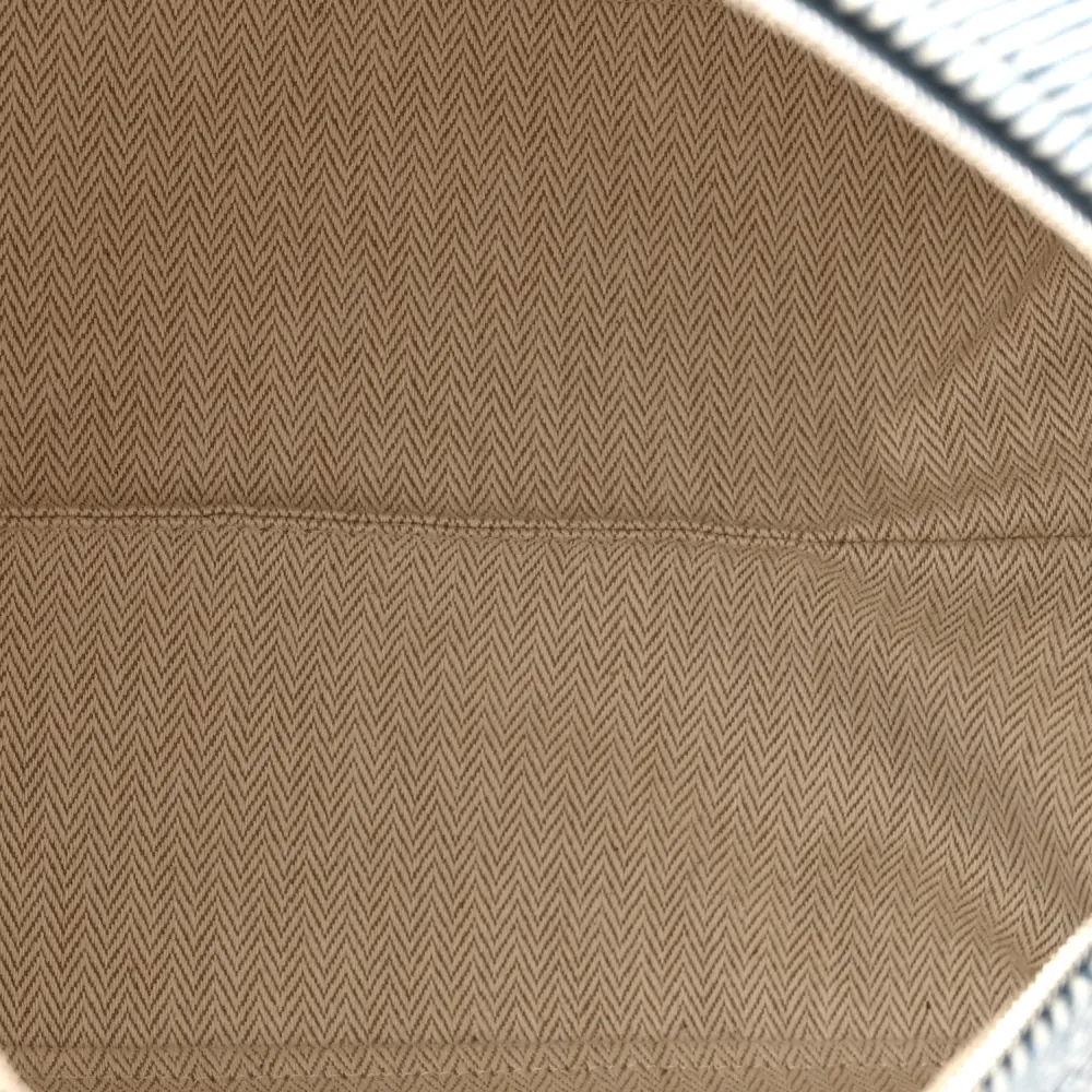 Interior view of the Herme$ Bleu Abysse Wool Large Bride-à-Brac H Natte Pouch