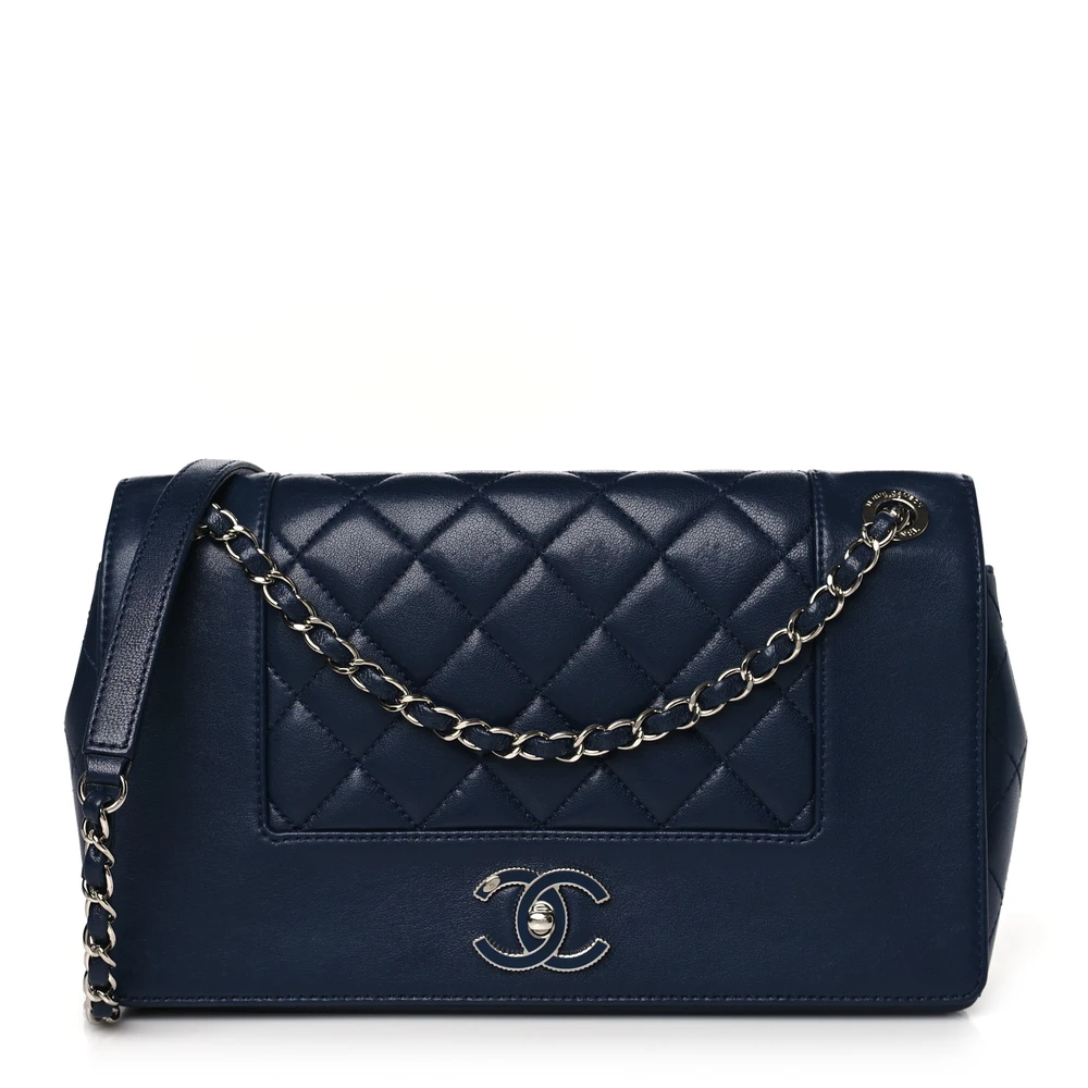 Front view of the dark navy sheepskin Vintage Mademoiselle Flap with blue enamel CC turn lock