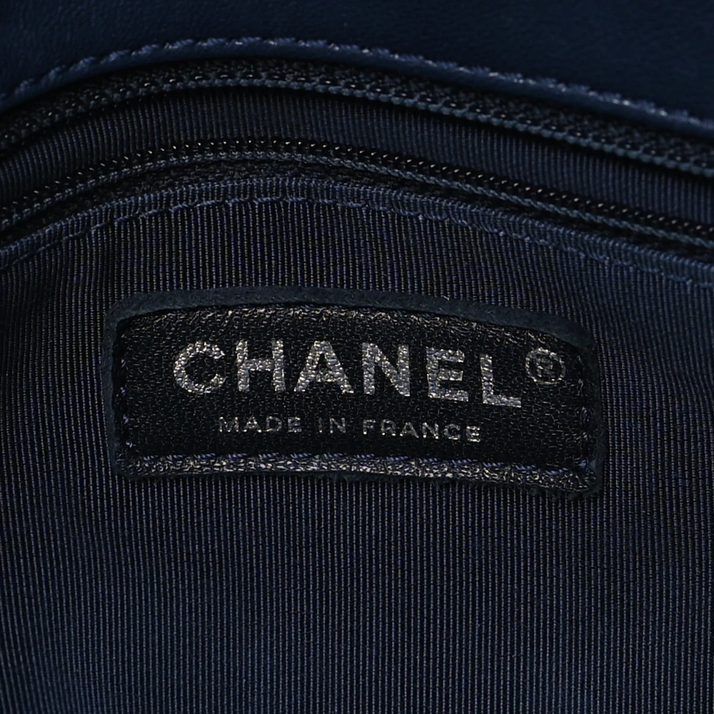 Close-up of the blue enamel CC turn lock and silver-tone hardware on the Vintage Mademoiselle Flap