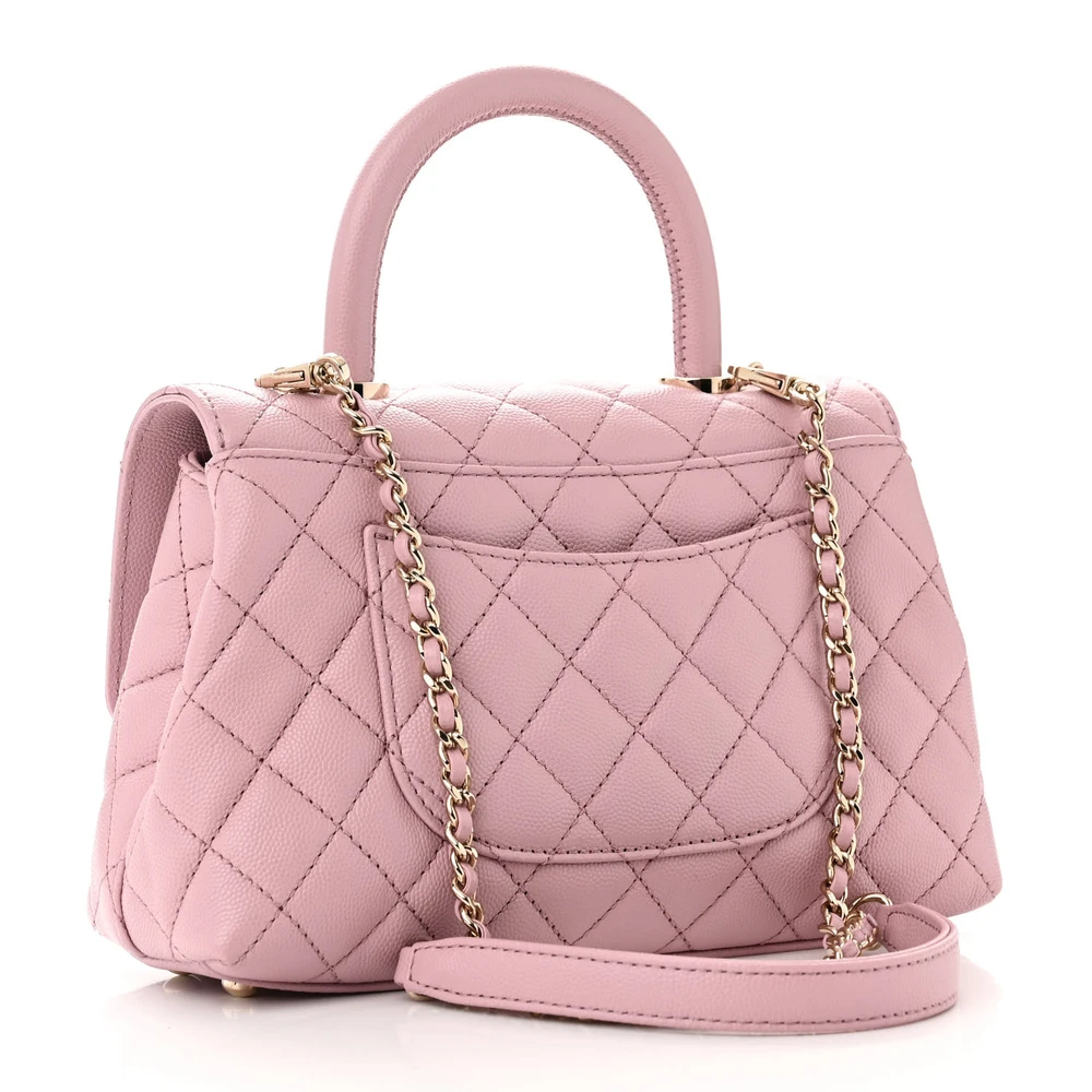 Back view of the light pink caviar leather Mini Coco Handle Flap