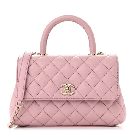 Front view of the light pink caviar leather Mini Coco Handle Flap with gold chain strap