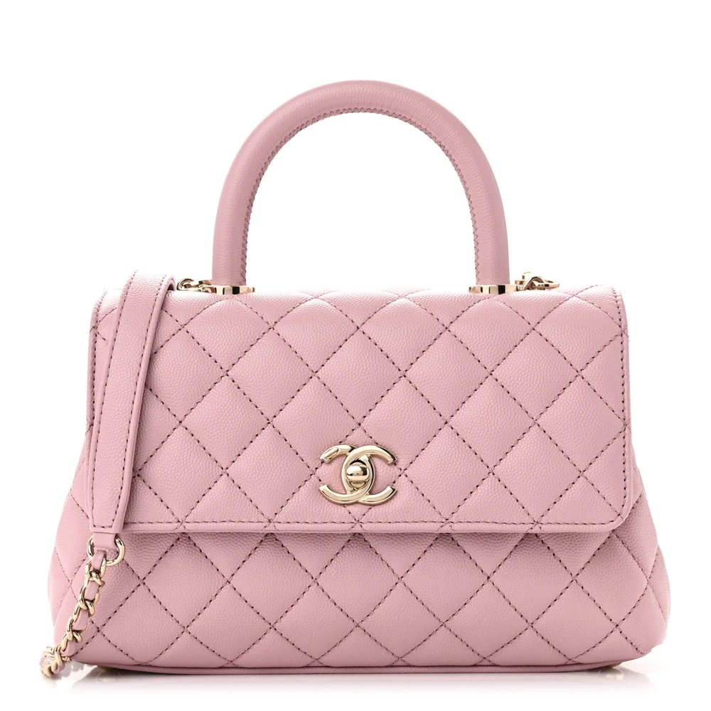 Front view of the light pink caviar leather Mini Coco Handle Flap with gold chain strap