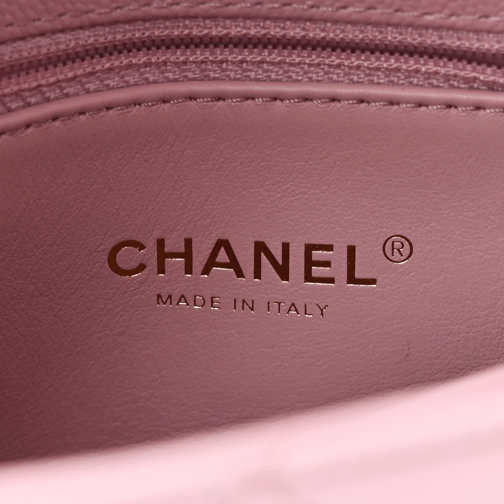 Close-up of the CC turn lock, gold chain strap, and gold-tone hardware on the Mini Coco Handle Flap