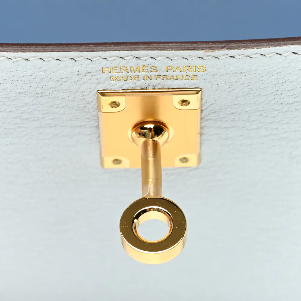 Close-up of the Kelly turn-lock, padlock, clochette, and Permabrass hardware on the Herme$ Mini Kelly Sellier 20