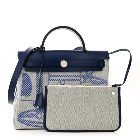 Front view of the Herme$ Herbag Zip Retourne 31 PM Brides de Gala in Bleu De France, Ecru, and Black