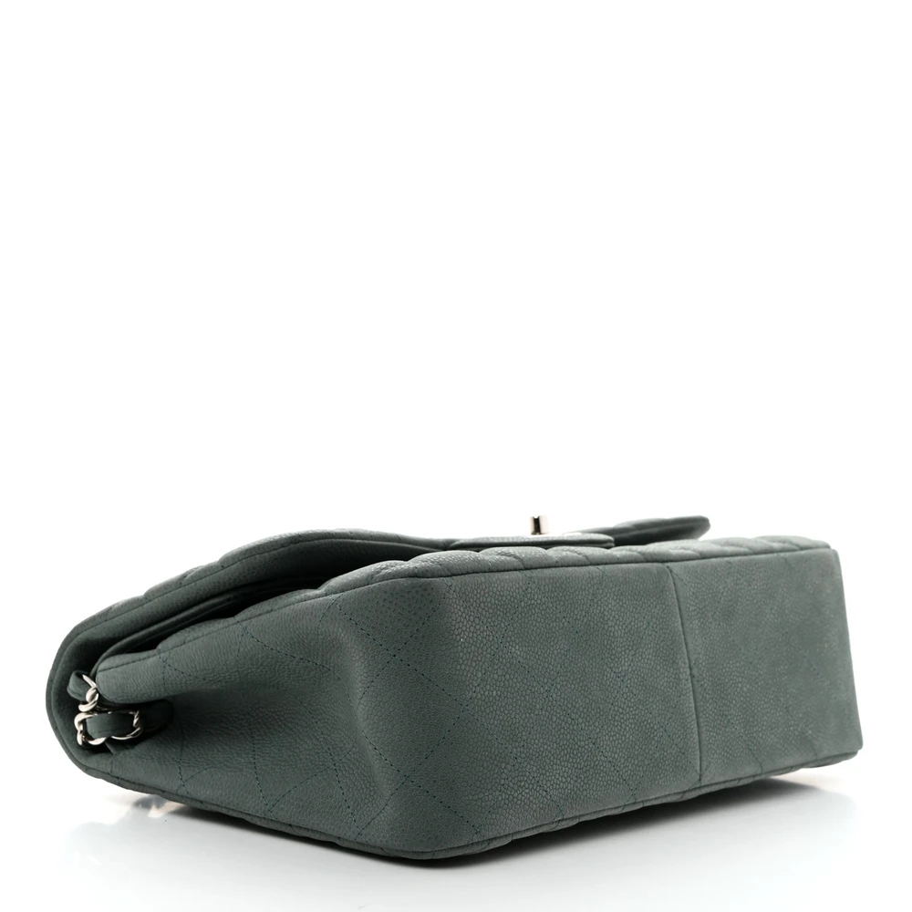 Bottom view of the green iridescent caviar leather Ch@nel Jumbo Double Flap with light gold chain strap