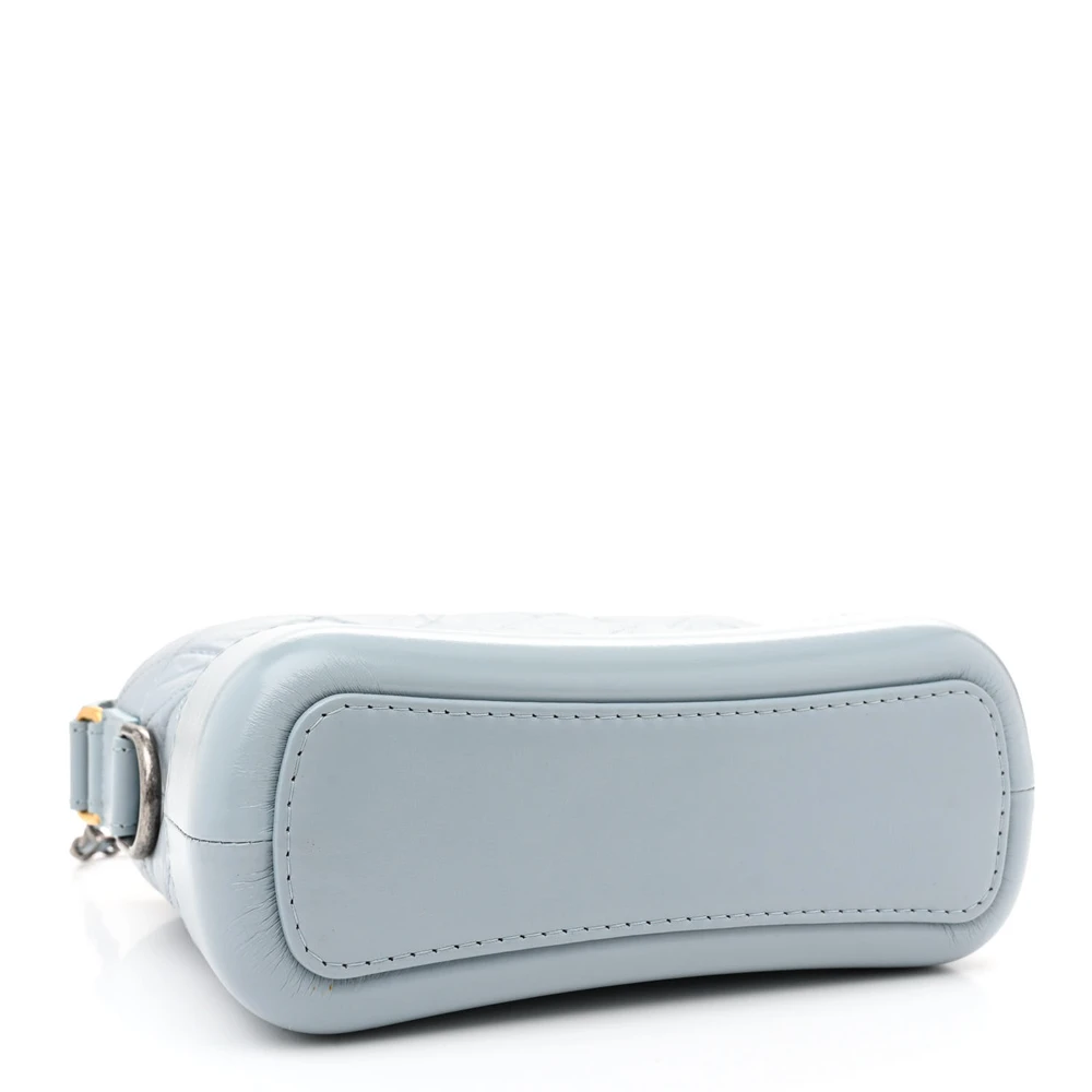 Bottom view of the light blue aged calfskin Gabrielle Hobo with mixed-metal chain strap