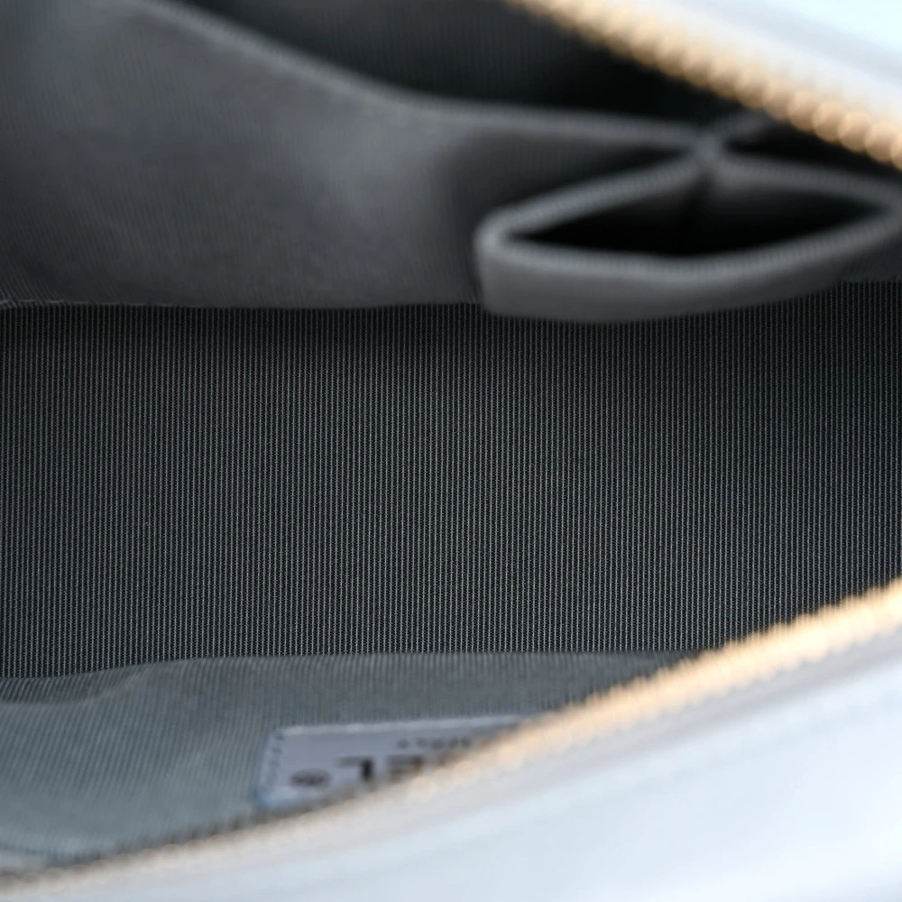 Interior view of the light blue aged calfskin Gabrielle Hobo with organized storage compartments