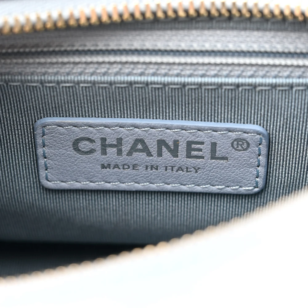 Close-up of the CC zipper pull, mixed-metal chain strap, shoulder pad, and mixed-tone hardware on the Gabrielle Hobo