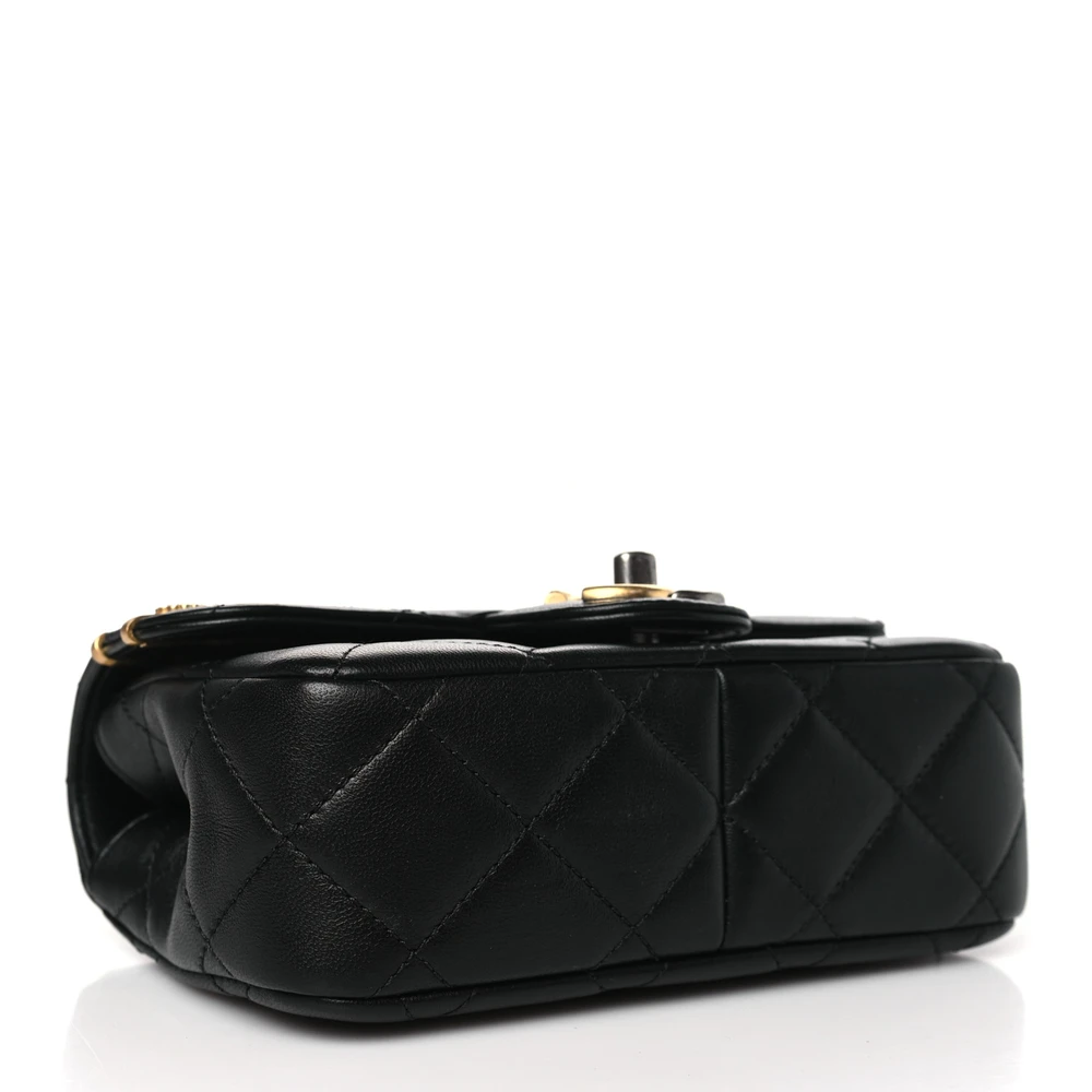 Bottom view of the black lambskin Ch@nel Mini Coco Clips Flap with decorative metal clips