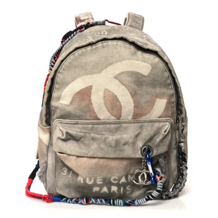 Front view of the grey Ch@nel Graffiti Canvas Backpack with 31 Rue Cambon print and CC logos