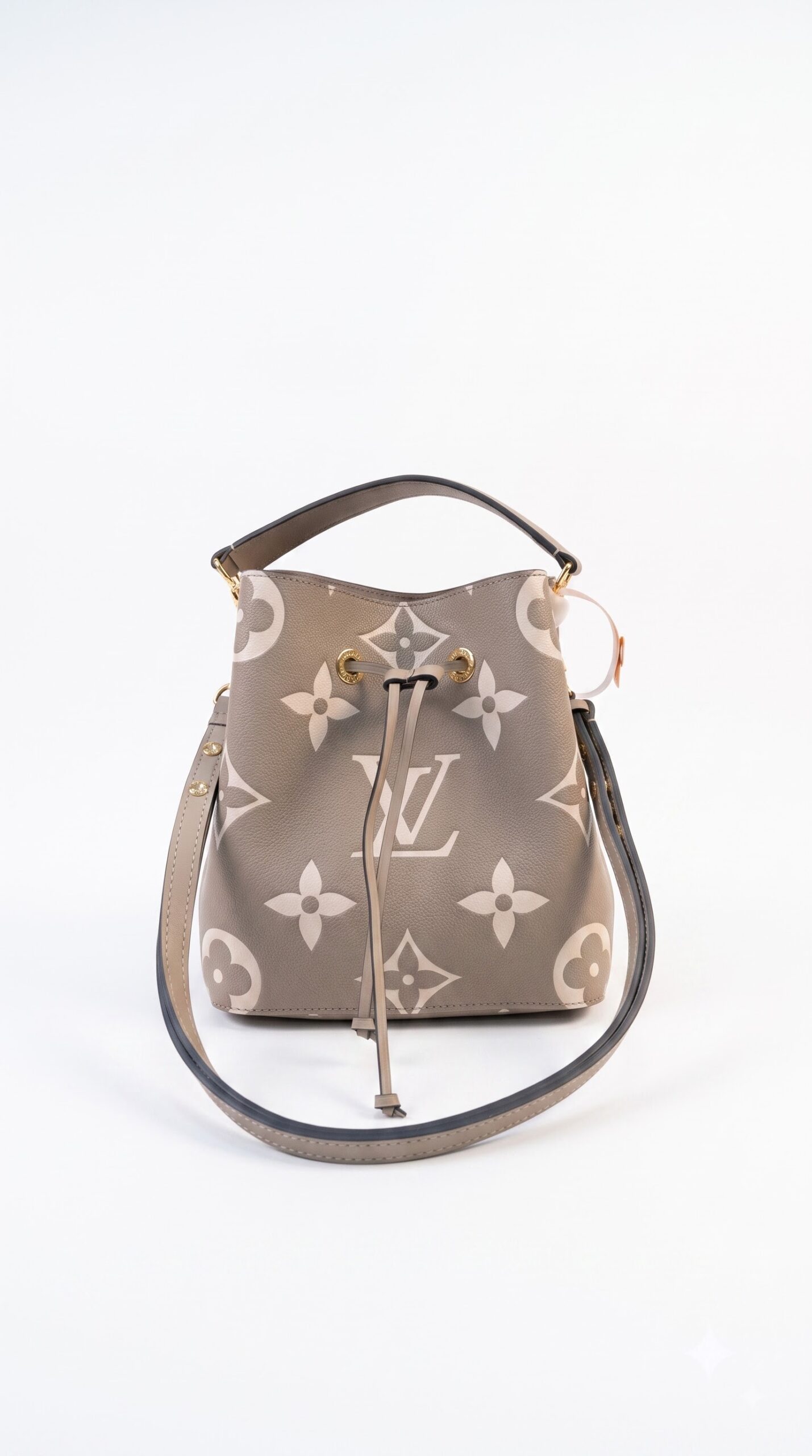Front view of the Lou!S Vuiton NéoNoé MM in Tourterelle and Crème bicolor Monogram Empreinte leather