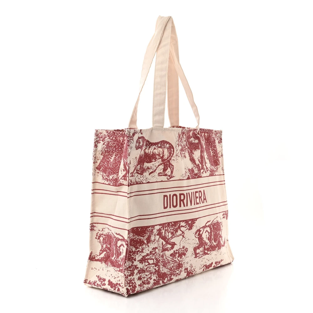 Back view of the natural straw D!0r Dioriviera Tote featuring an intricate red design