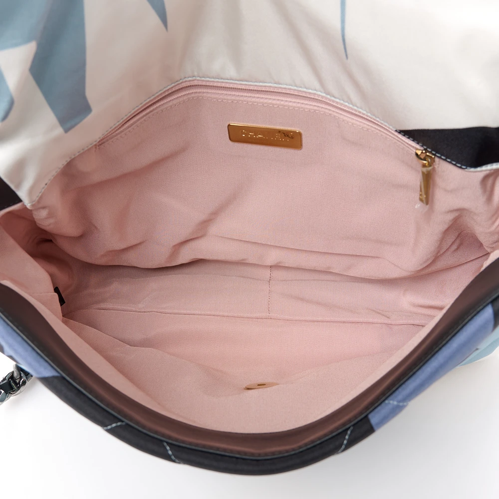 Interior view of the Ch@nel Maxi Scarf Flap Bag showing its pink fabric lining and zipper pocket
