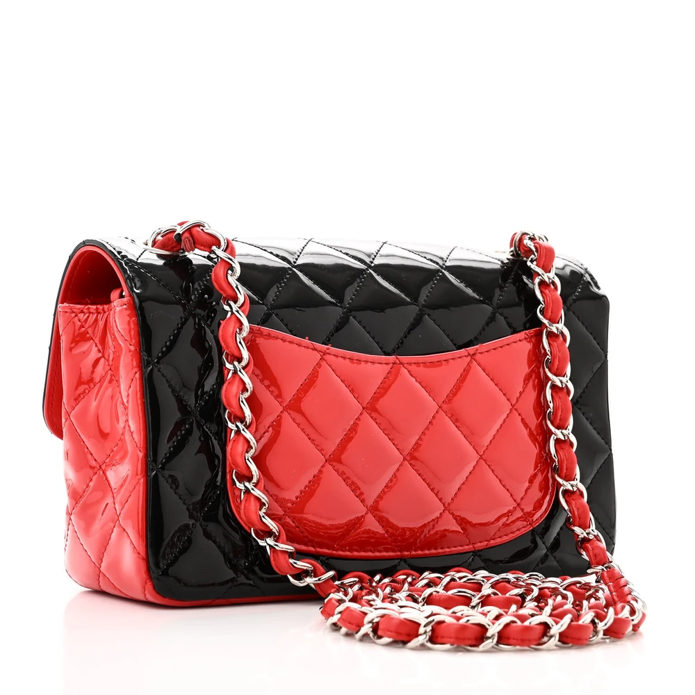 Back view of the red and black Ch@nel Mini Rectangular Flap with silver-tone chain and CC turn-lock