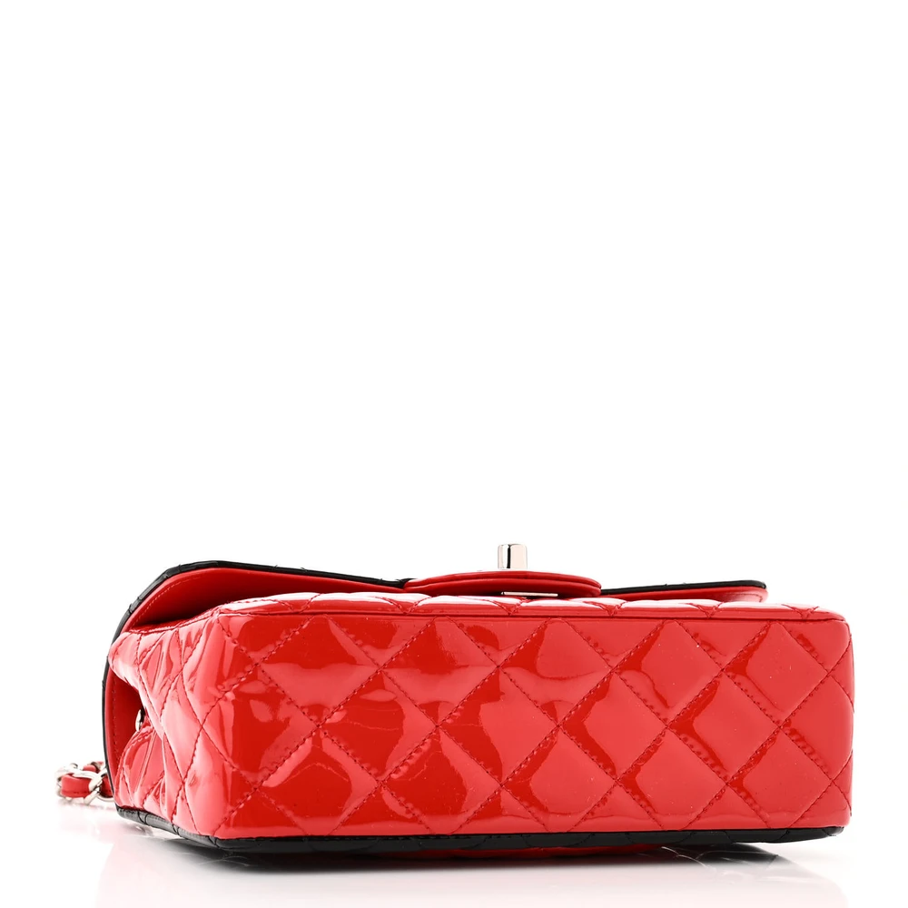 Bottom view of the red and black Ch@nel Mini Rectangular Flap with silver-tone chain and CC turn-lock