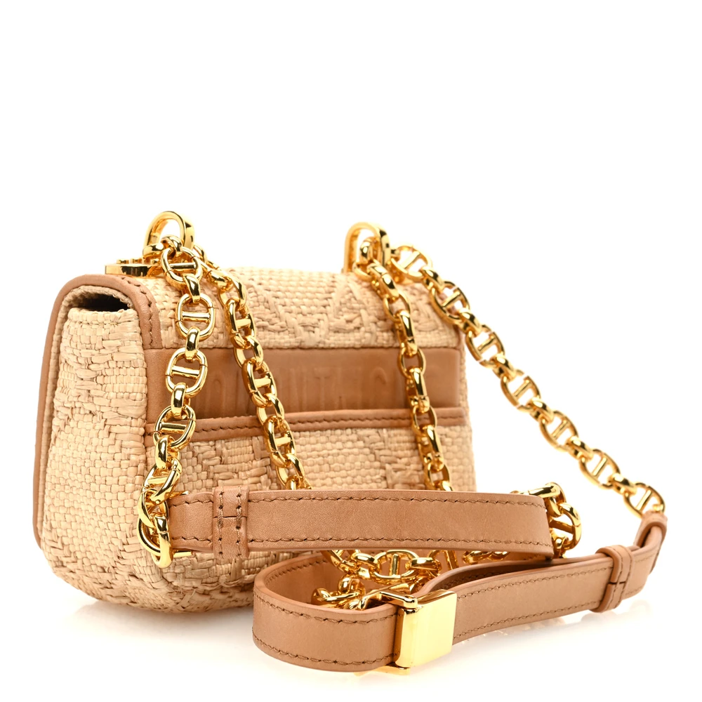Back view of the natural raffia D!0r Micro Caro Bag featuring the Macro Cannage motif