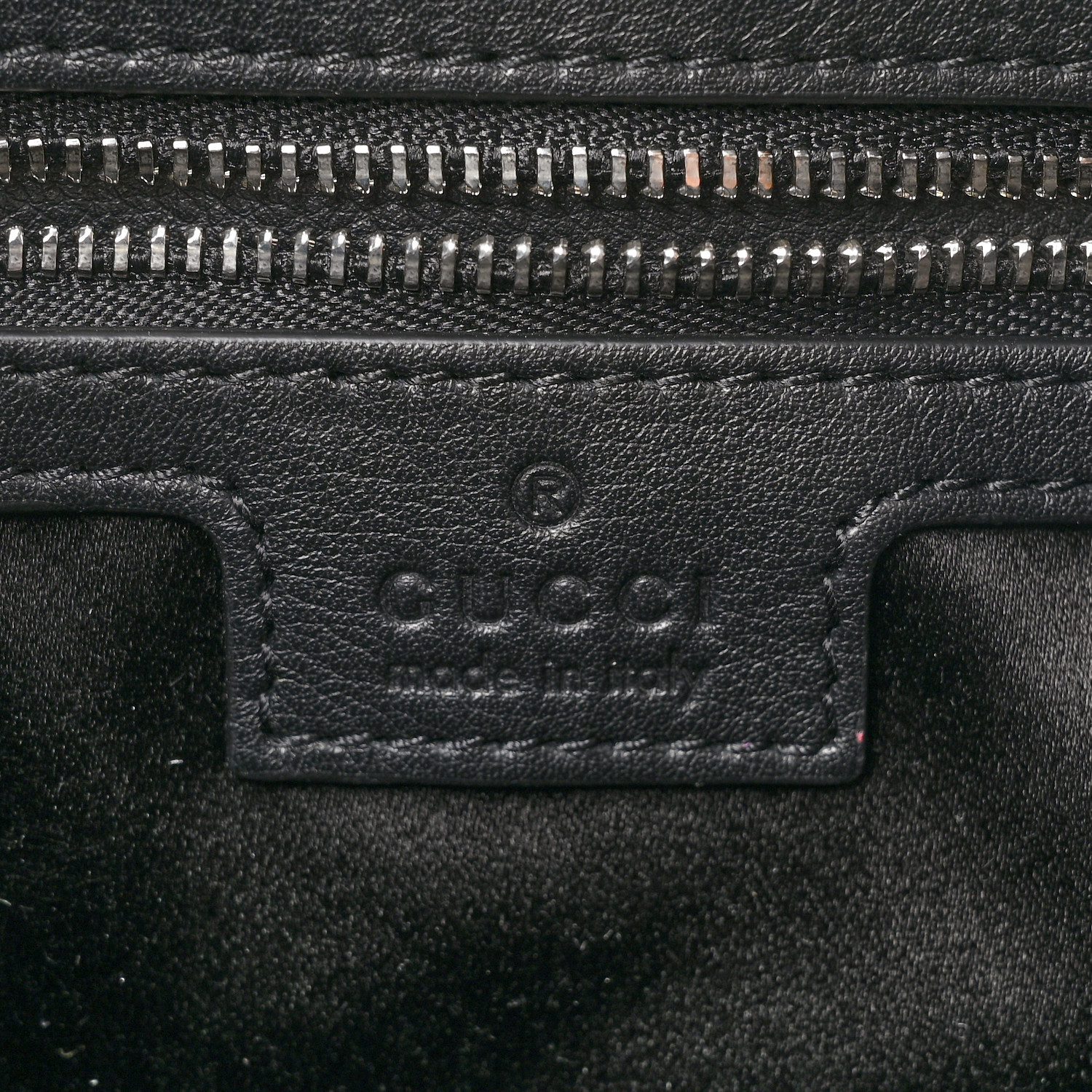 Close-up of the tonal GG monogram, piston-style closure, leather trim, and hardware on the black velvet Jackie 1961 Hobo