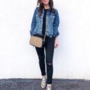 Model carrying the beige and black Gucc! Small GG Marmont chain shoulder bag