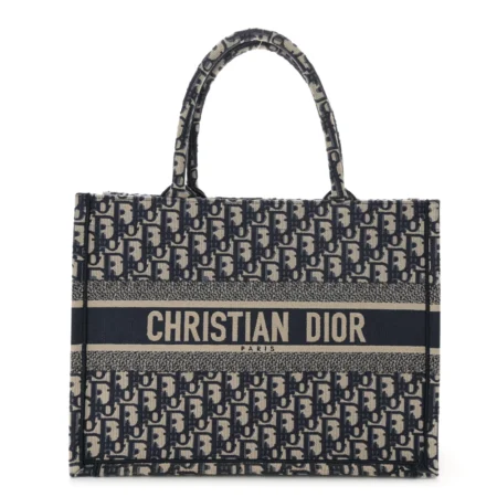 Front view of the navy and beige Oblique print D!0r Medium Book Tote with embroidered D!0r logo