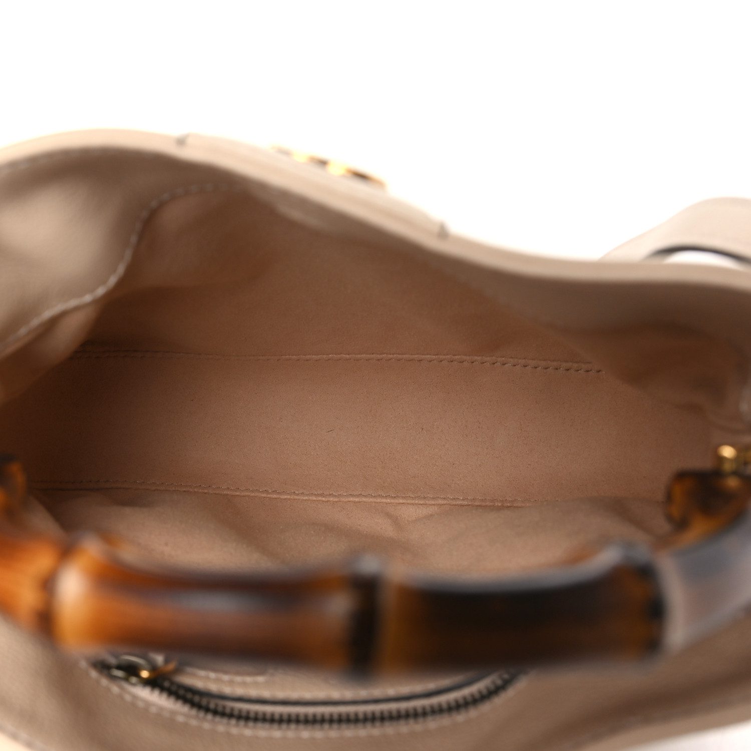 Interior view of the light beige Gucc! Small Diana Shoulder Bag with its main compartment